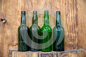 Bottles for traditional natural Asturian cider made fromÃÂ fermented apples in barrels for several months should be poured from photo